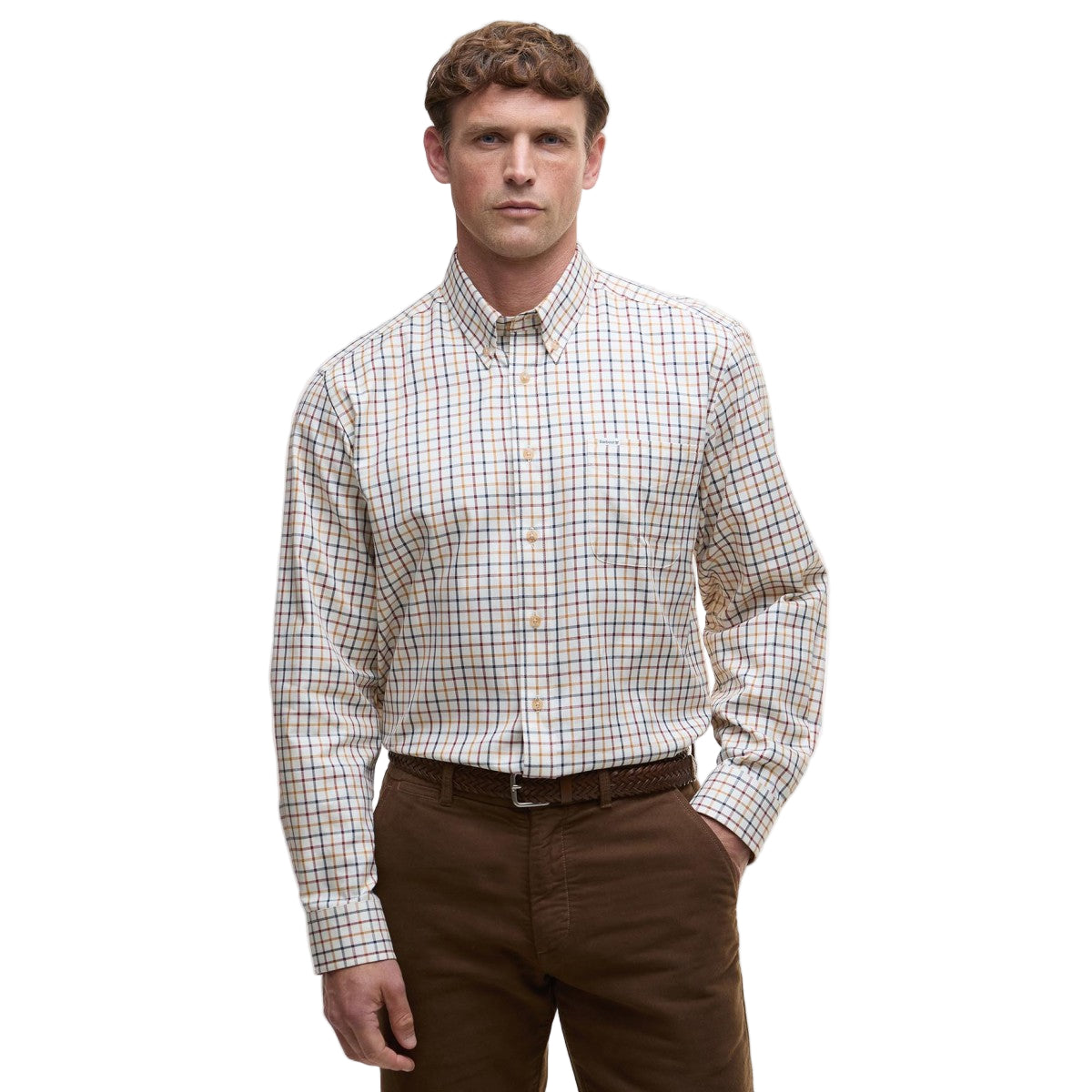 Man wearing a Barbour plaid shirt and brown pants on a white background