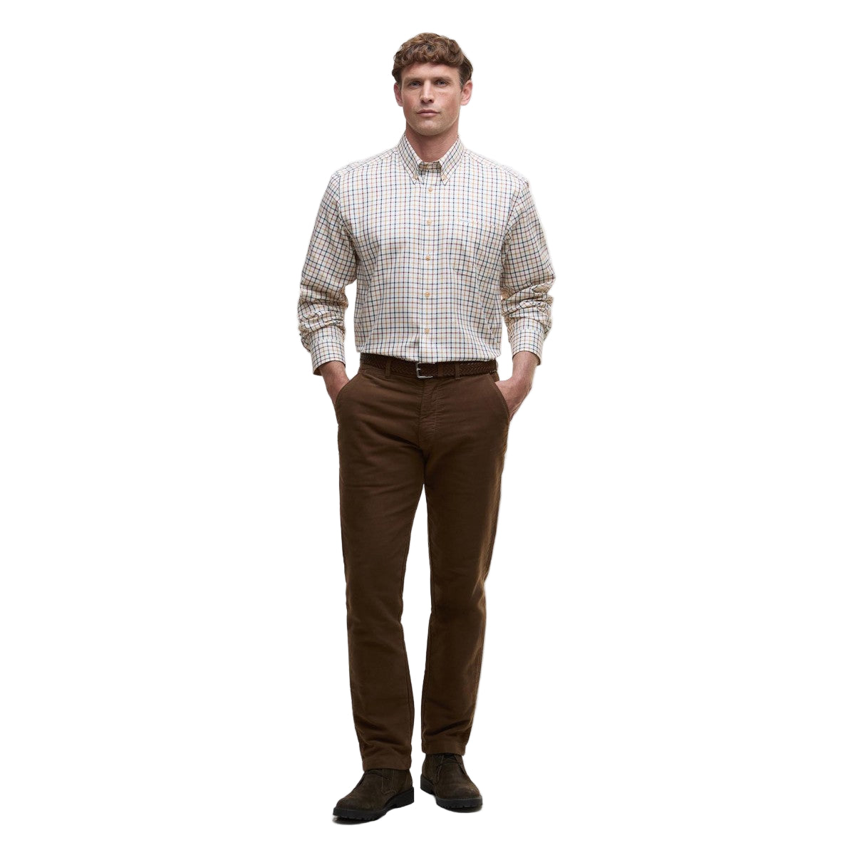 Man wearing a Barbour plaid shirt and brown pants on a white background