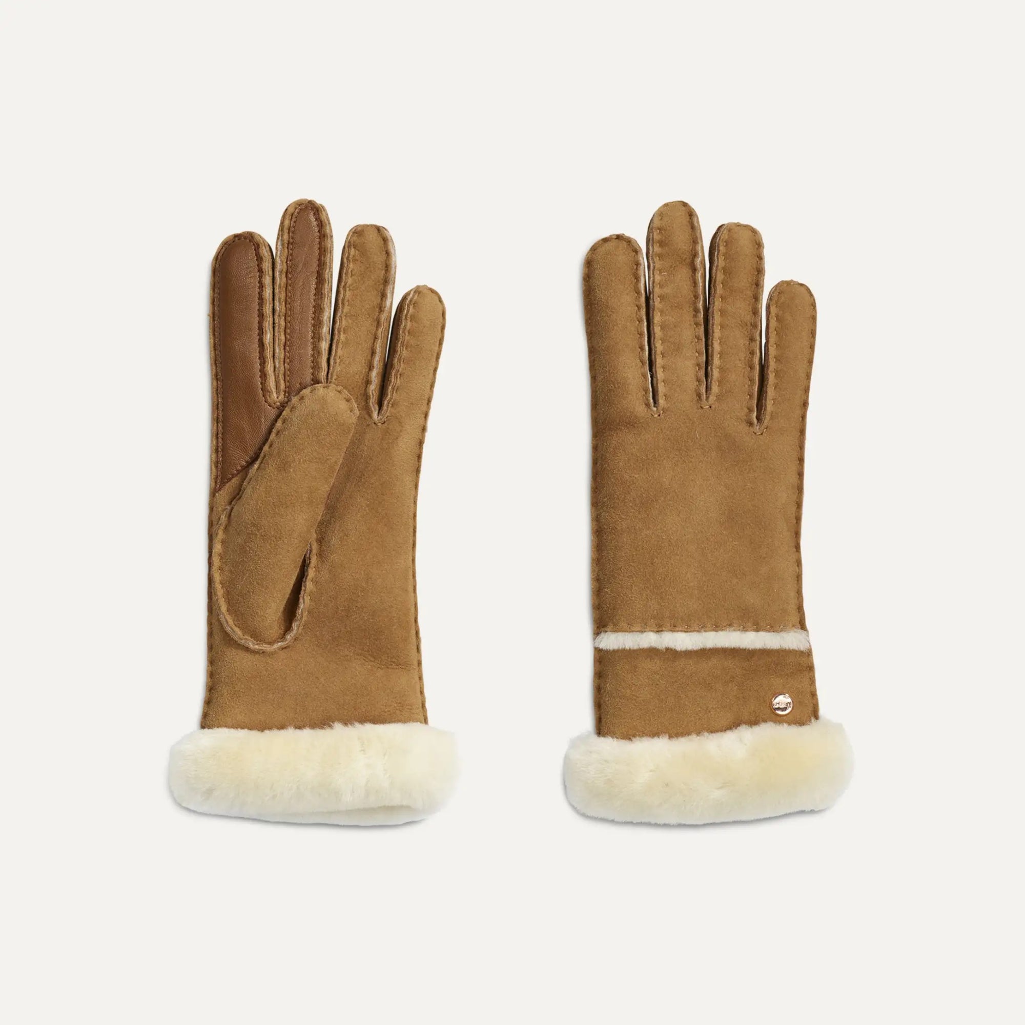 Pair of brown UGG gloves with white fur lining on a light gray background