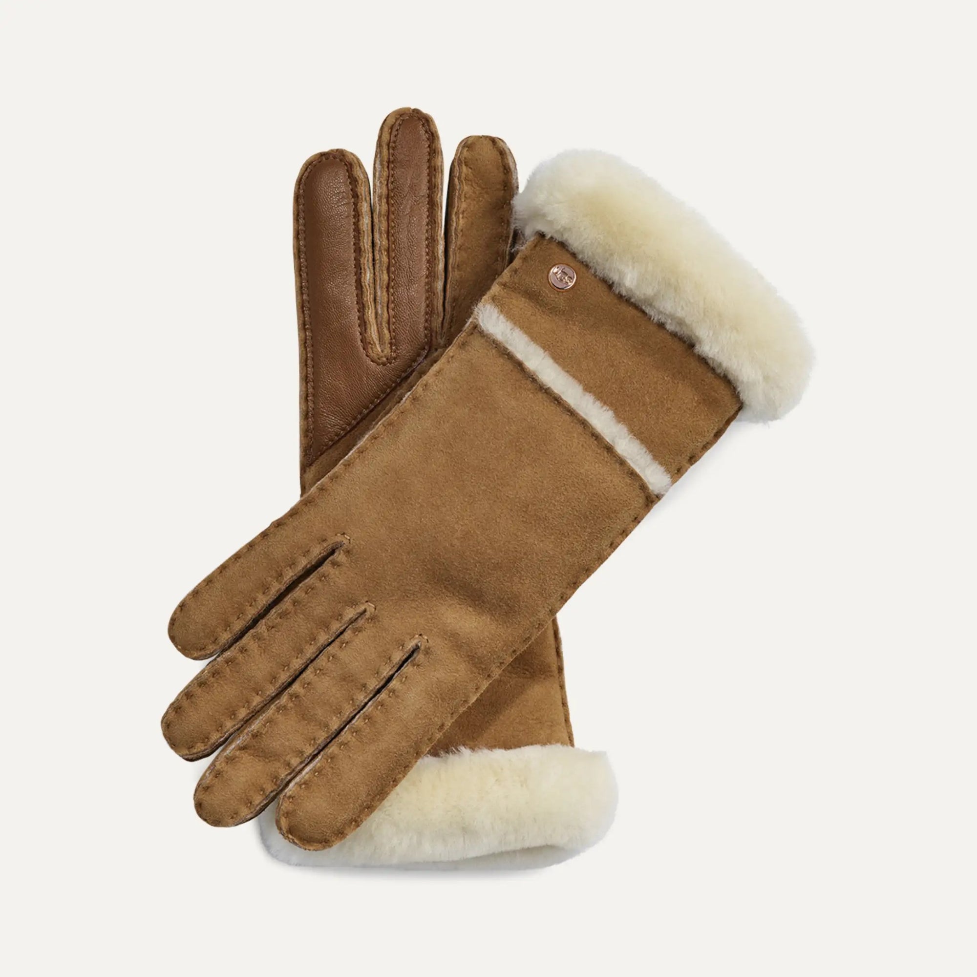 Pair of brown UGG gloves with white fur lining on a light gray background