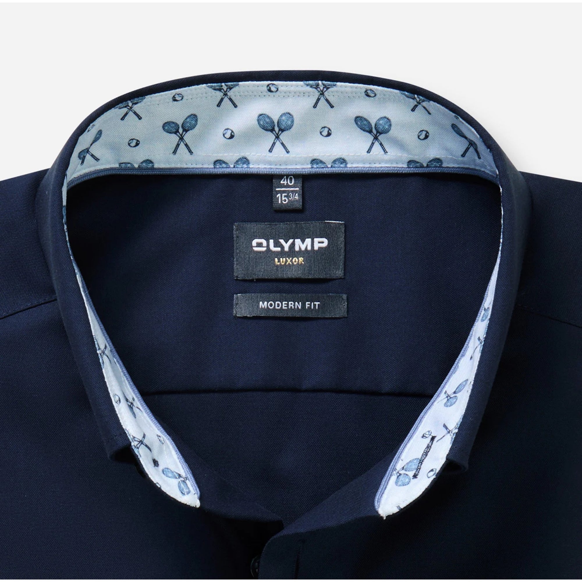 Navy shirt with patterned inside collar and Olympus label