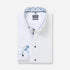 White dress shirt with blue floral patterns on a white background