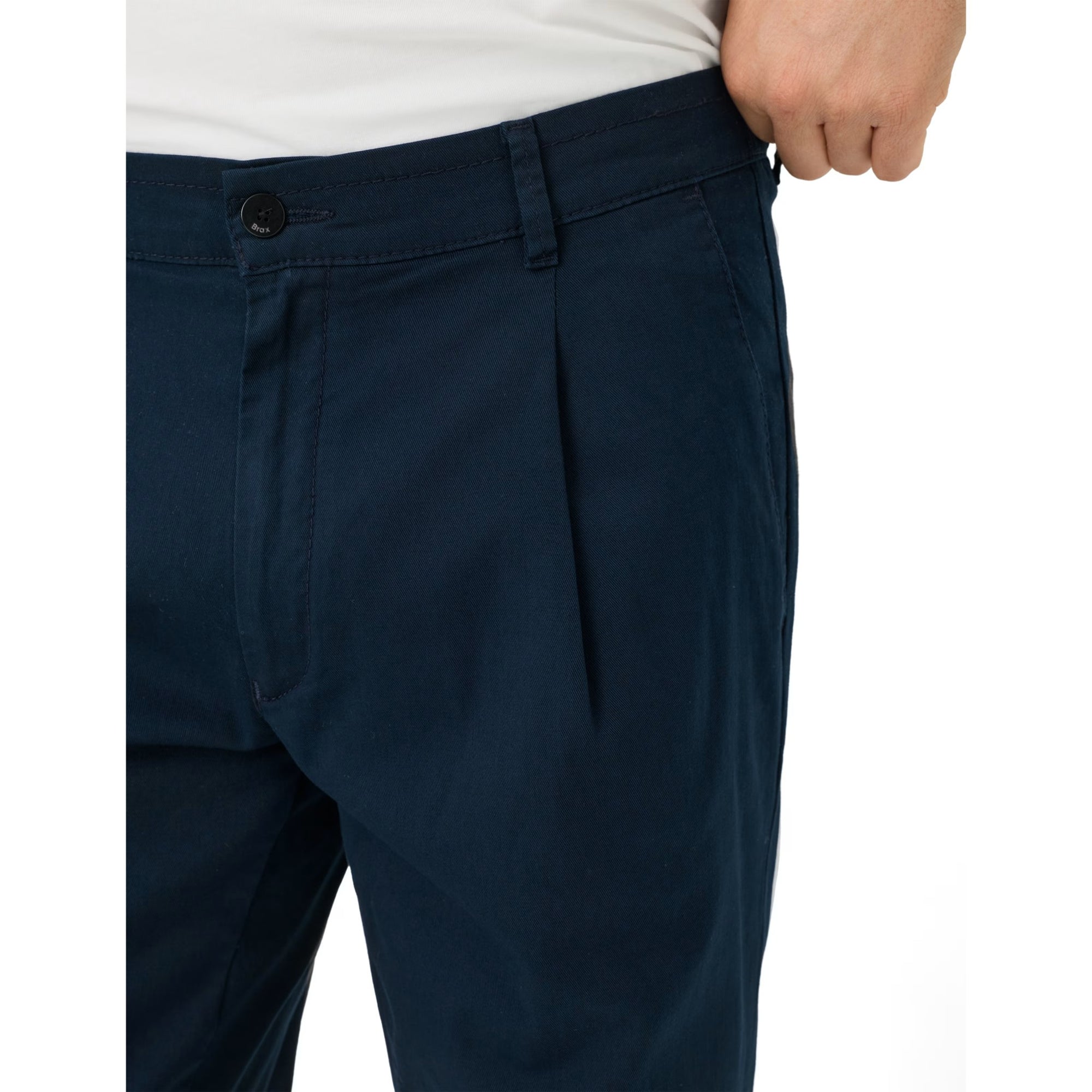 Navy blue pants worn by a person on a white background