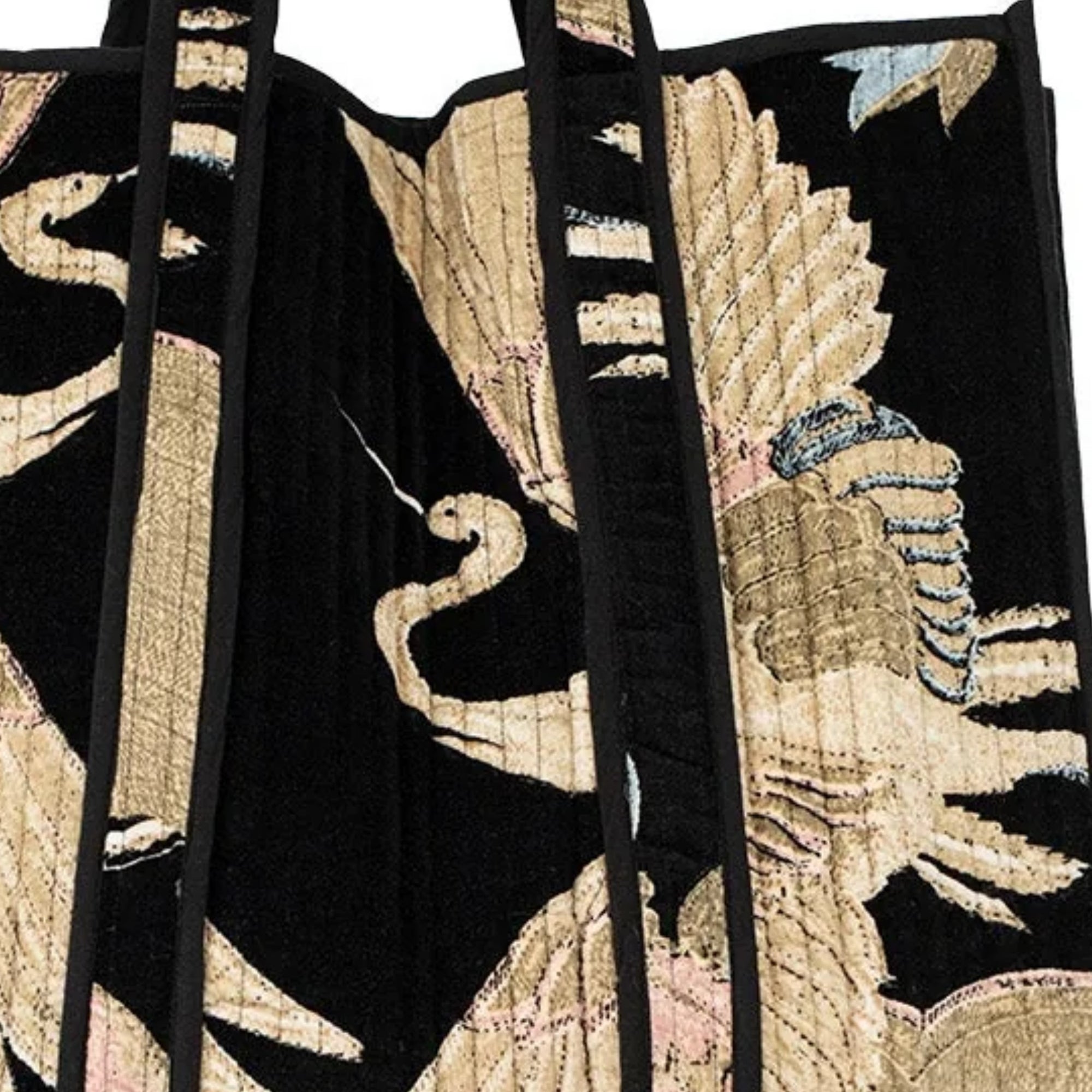 Embroidered fabric with bird design on a black background