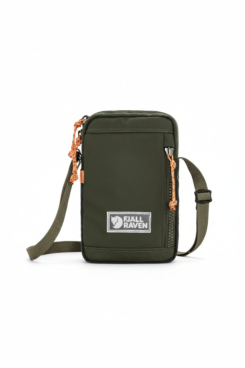 Deep forest crossbody bag with orange zippers and Fjällräven logo on a white background