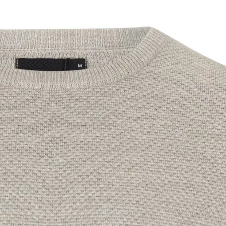 Remus Uomo Close-up of a gray sweater with a brand label on a white background