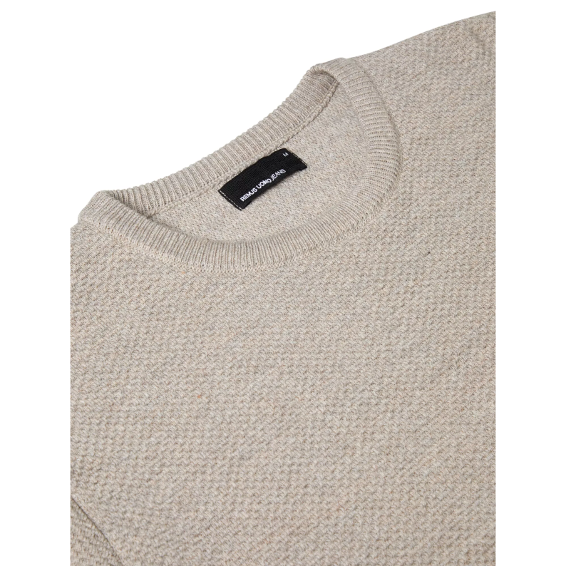 Remus Uomo Close-up of a beige sweater with a brand label on a white background