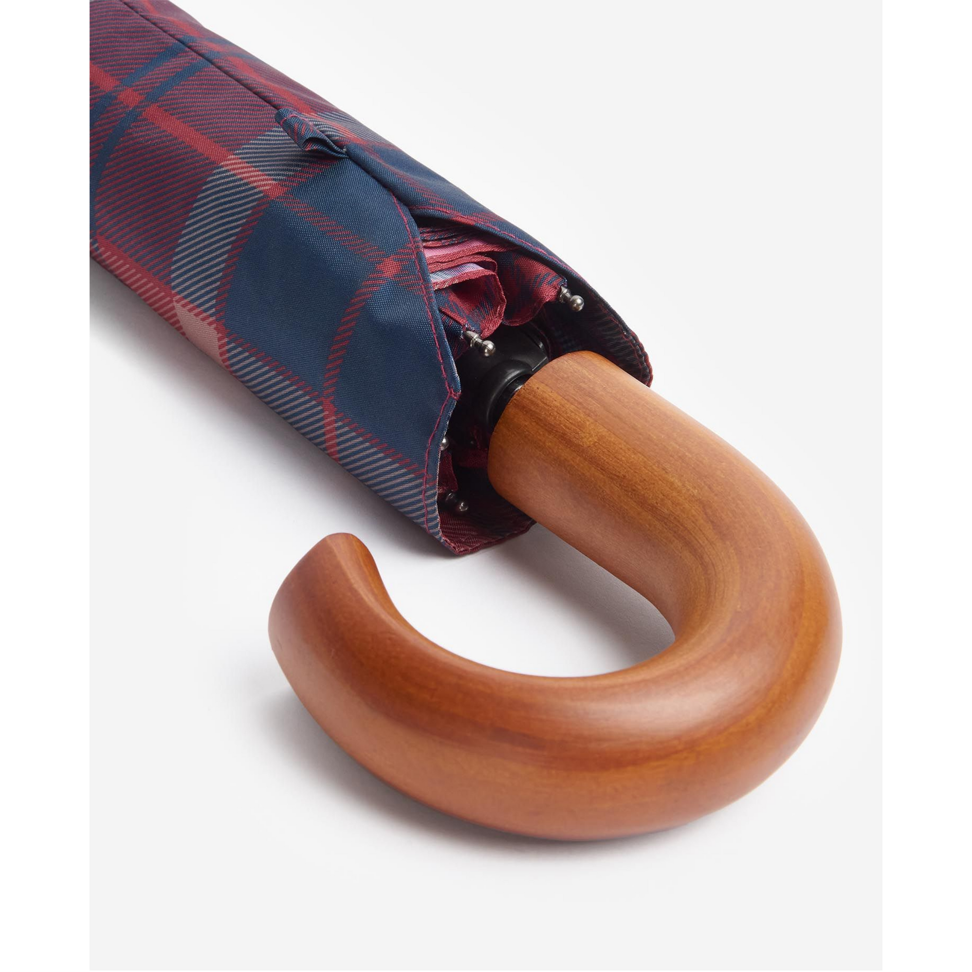 Plaid umbrella with wooden handle on a white background