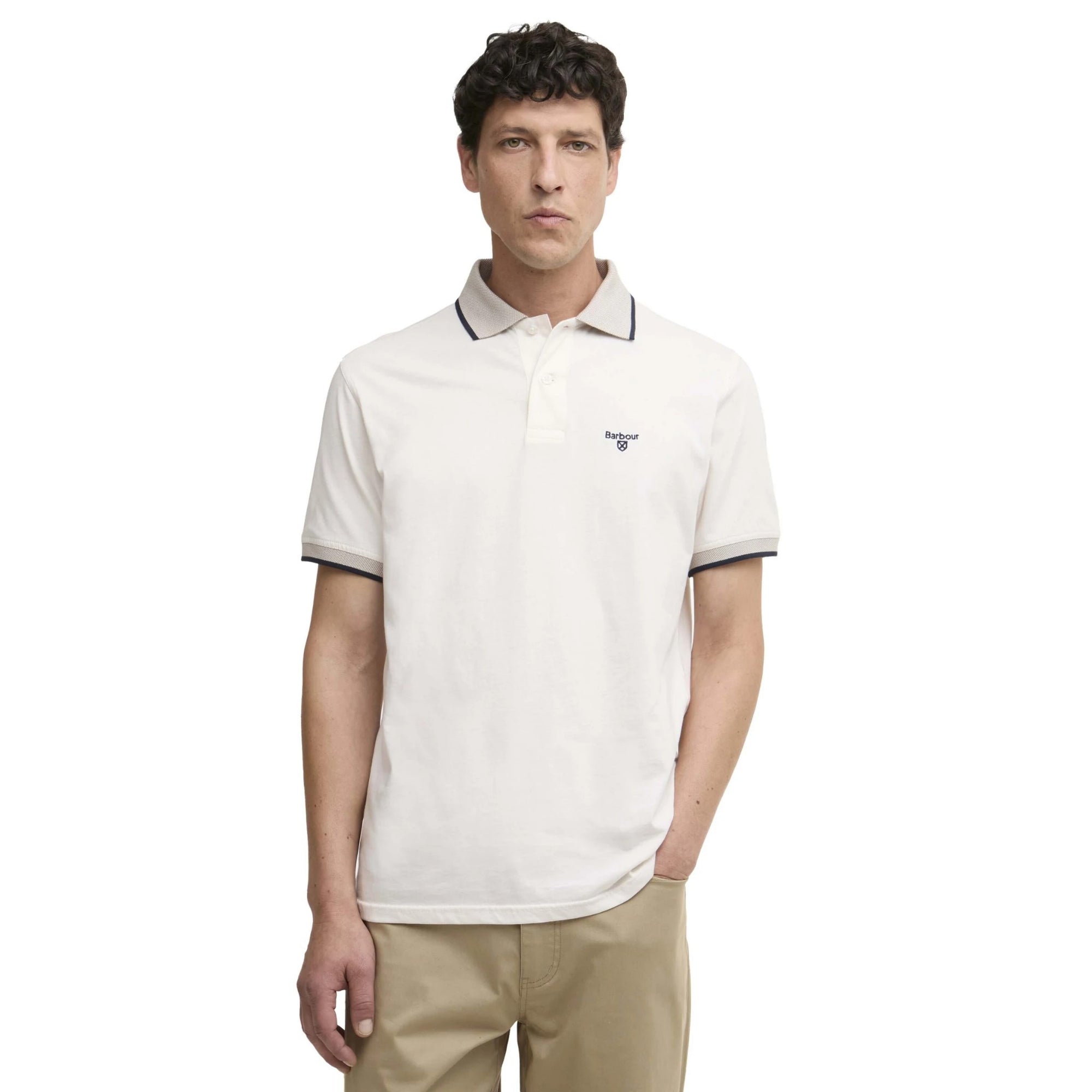 Man wearing a white polo shirt with black trim on a white background