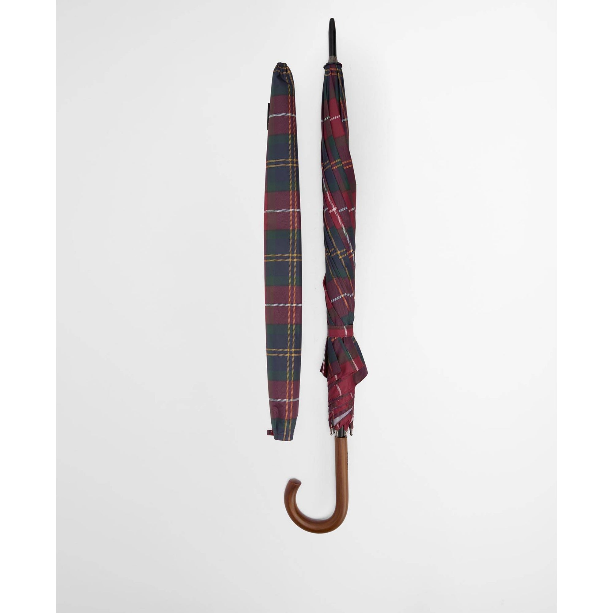 Plaid umbrella with wooden handle on a white background