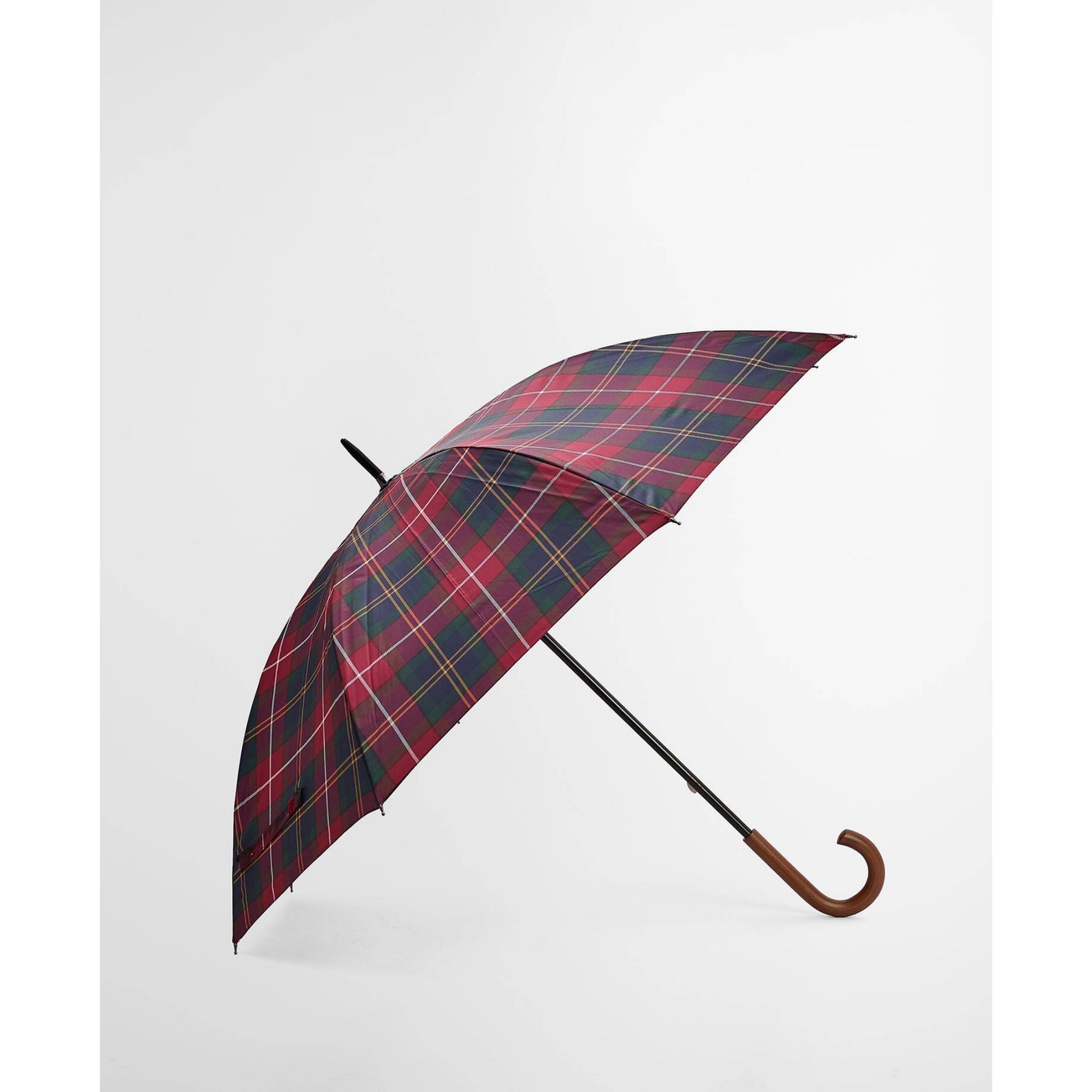 Red and black plaid umbrella with wooden handle on a white background