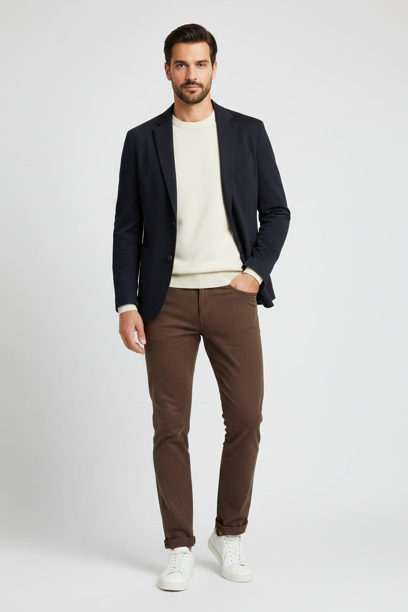 A pair of slim-fit brown Brax jeans shown flat against a light gray background.
