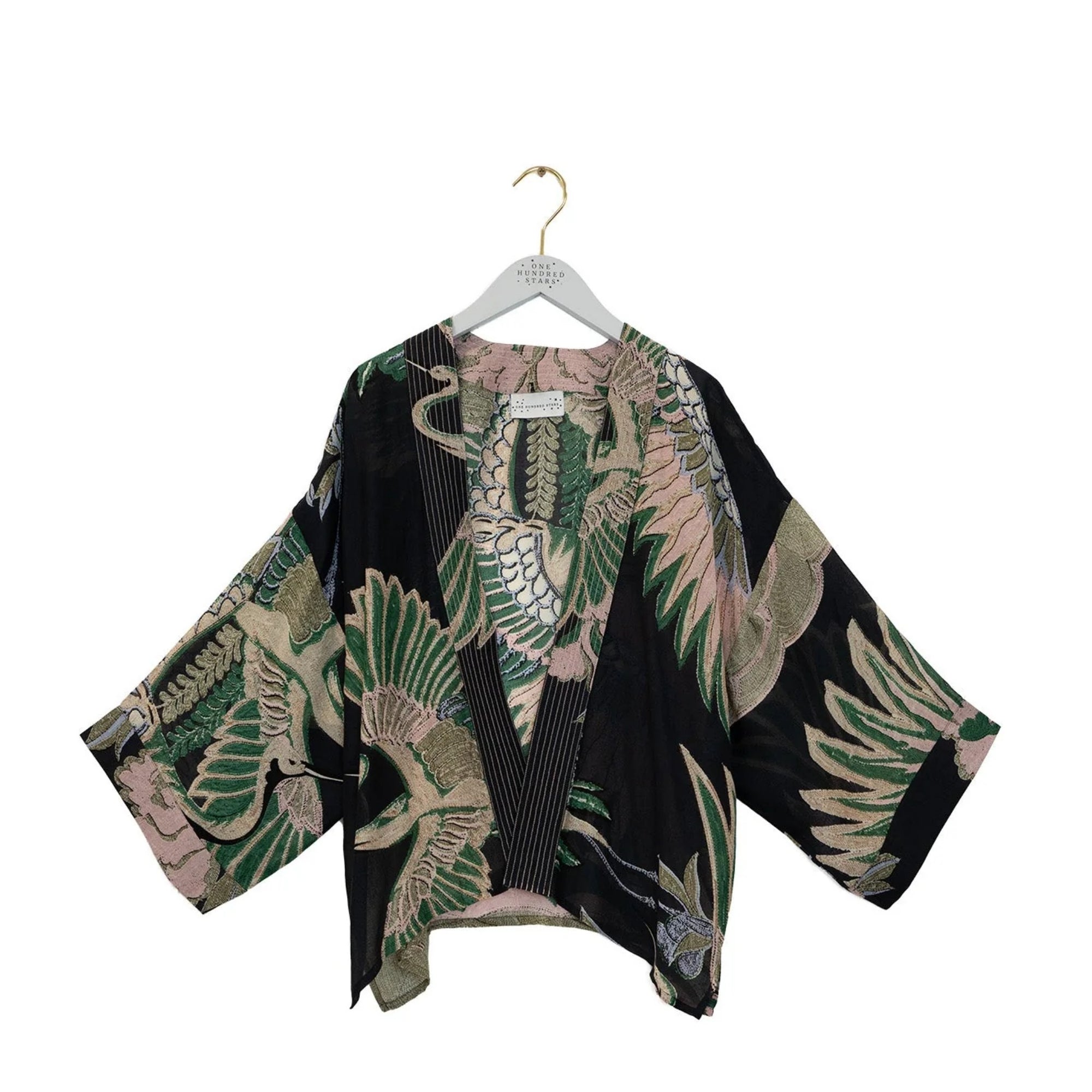 Floral kimono on a hanger against a white background