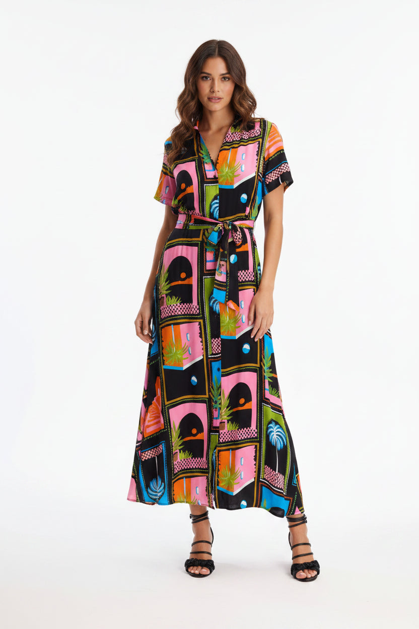 Woman wearing a colorful patterned dress on a white background