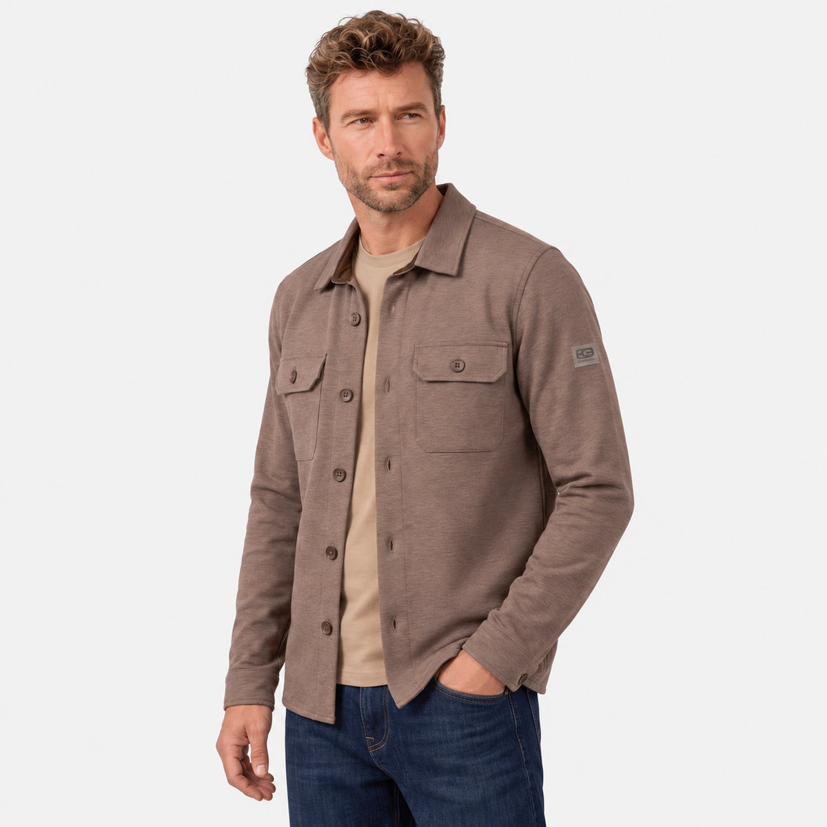 Three-quarter view of the Giordano Taranto Shell beige overshirt, showing chest pockets and sleeve badge.