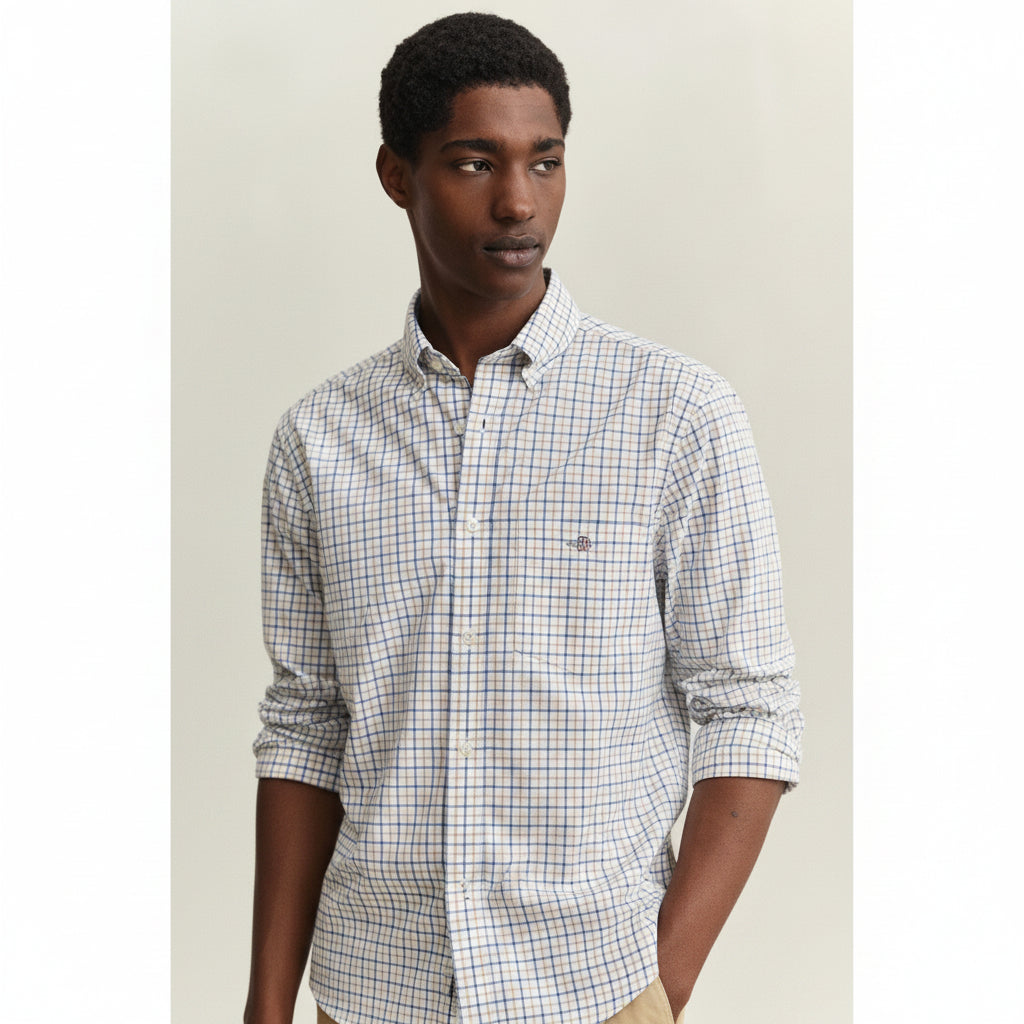 Man wearing a checkered shirt against a plain background