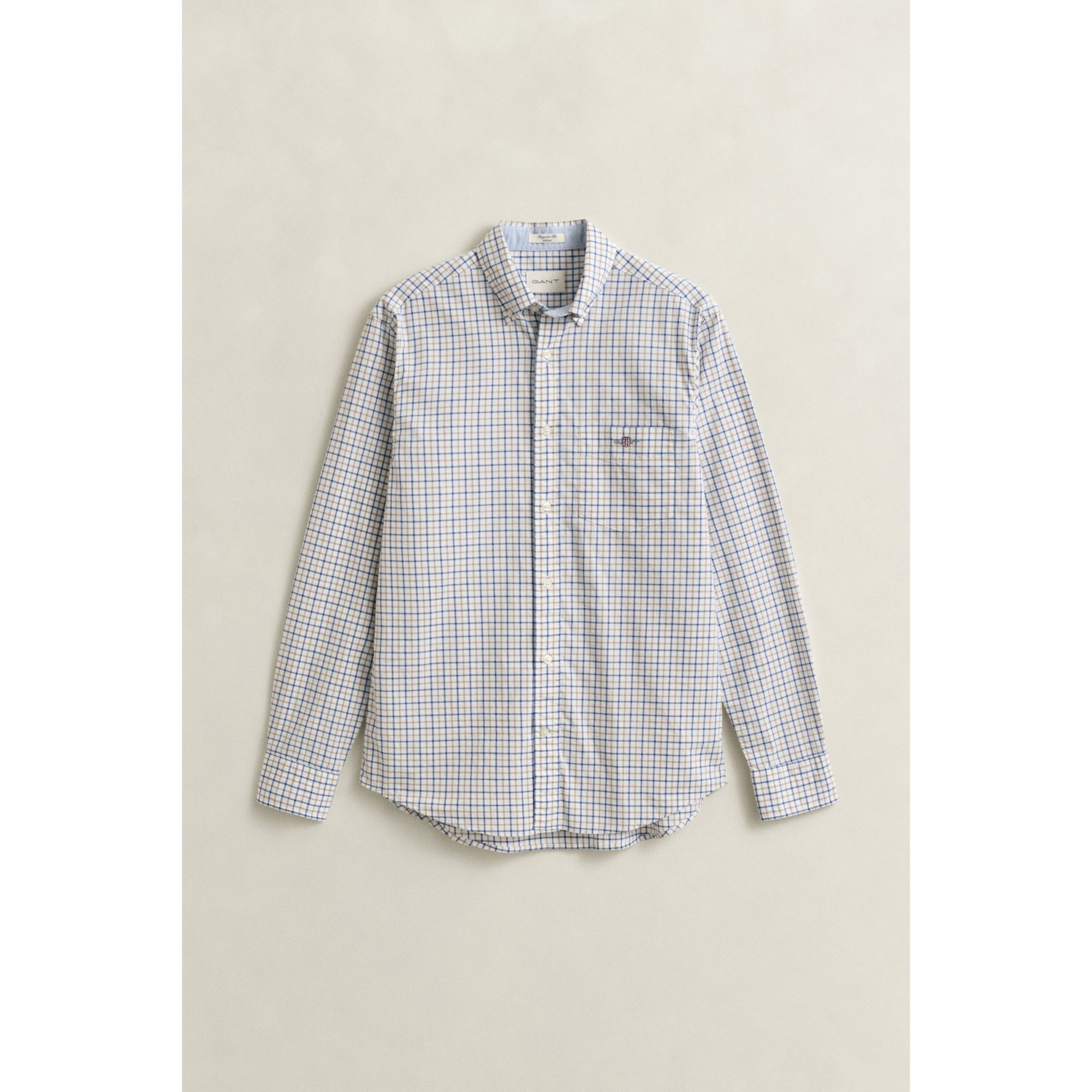 Checkered shirt on a beige background