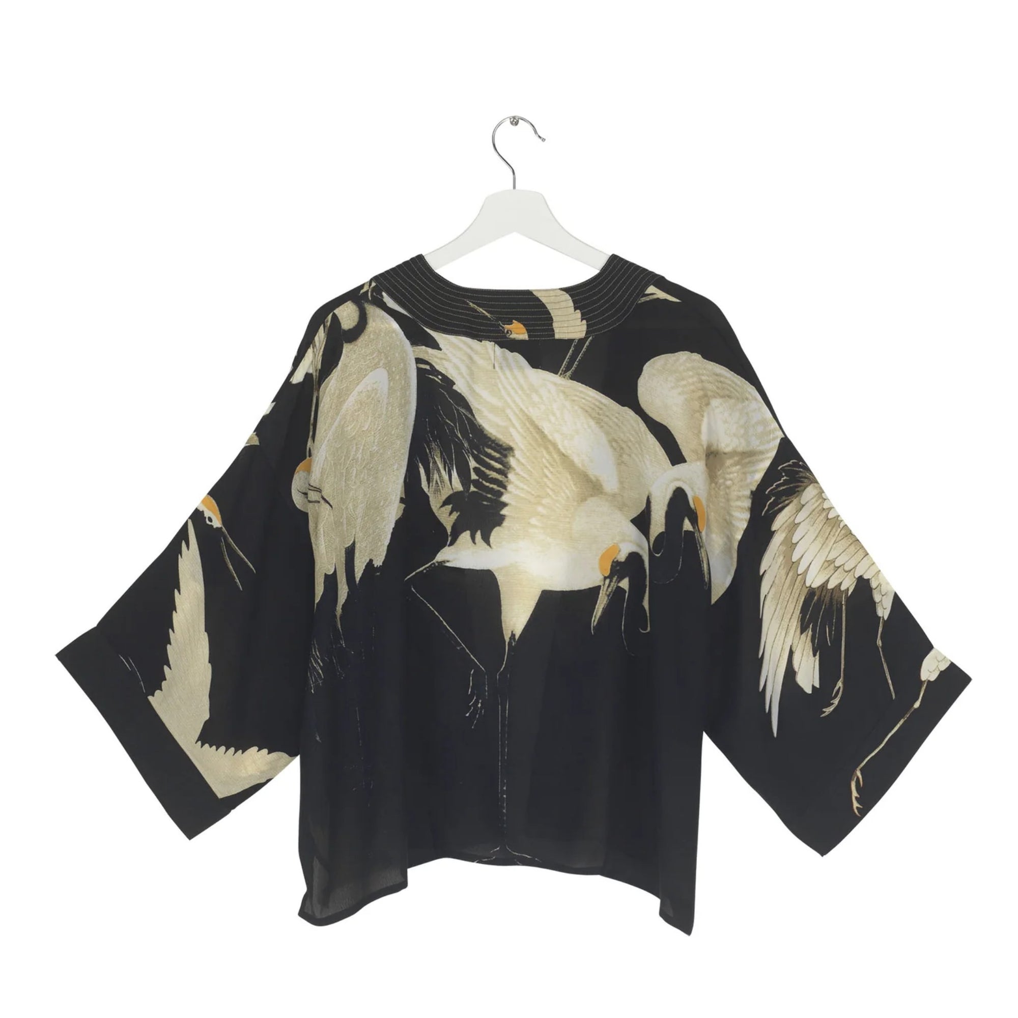 Black kimono with crane bird pattern on a white background