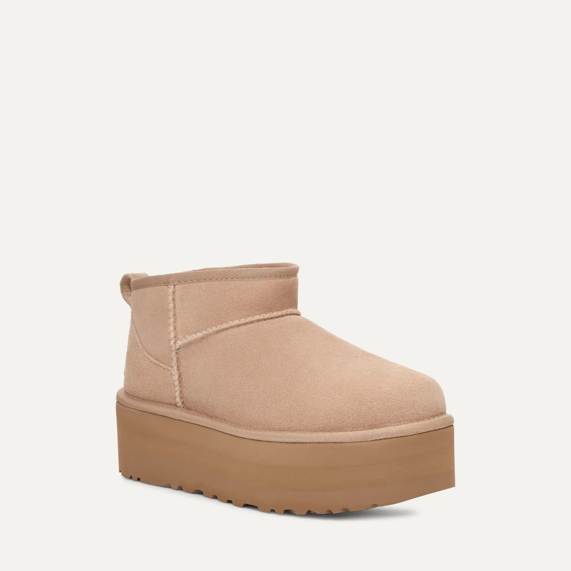 Beige platform boot on a white background