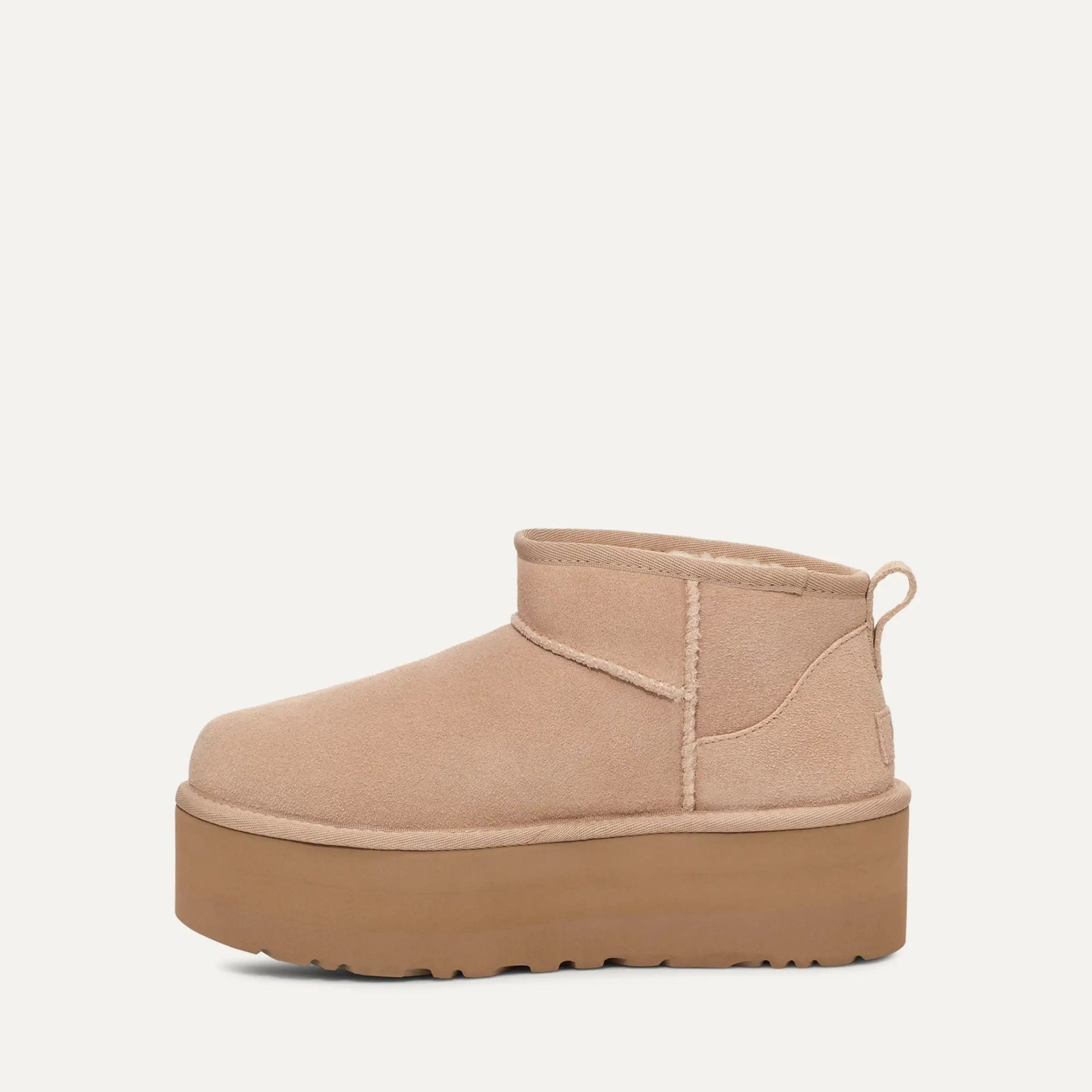 Beige platform ankle boot on a white background