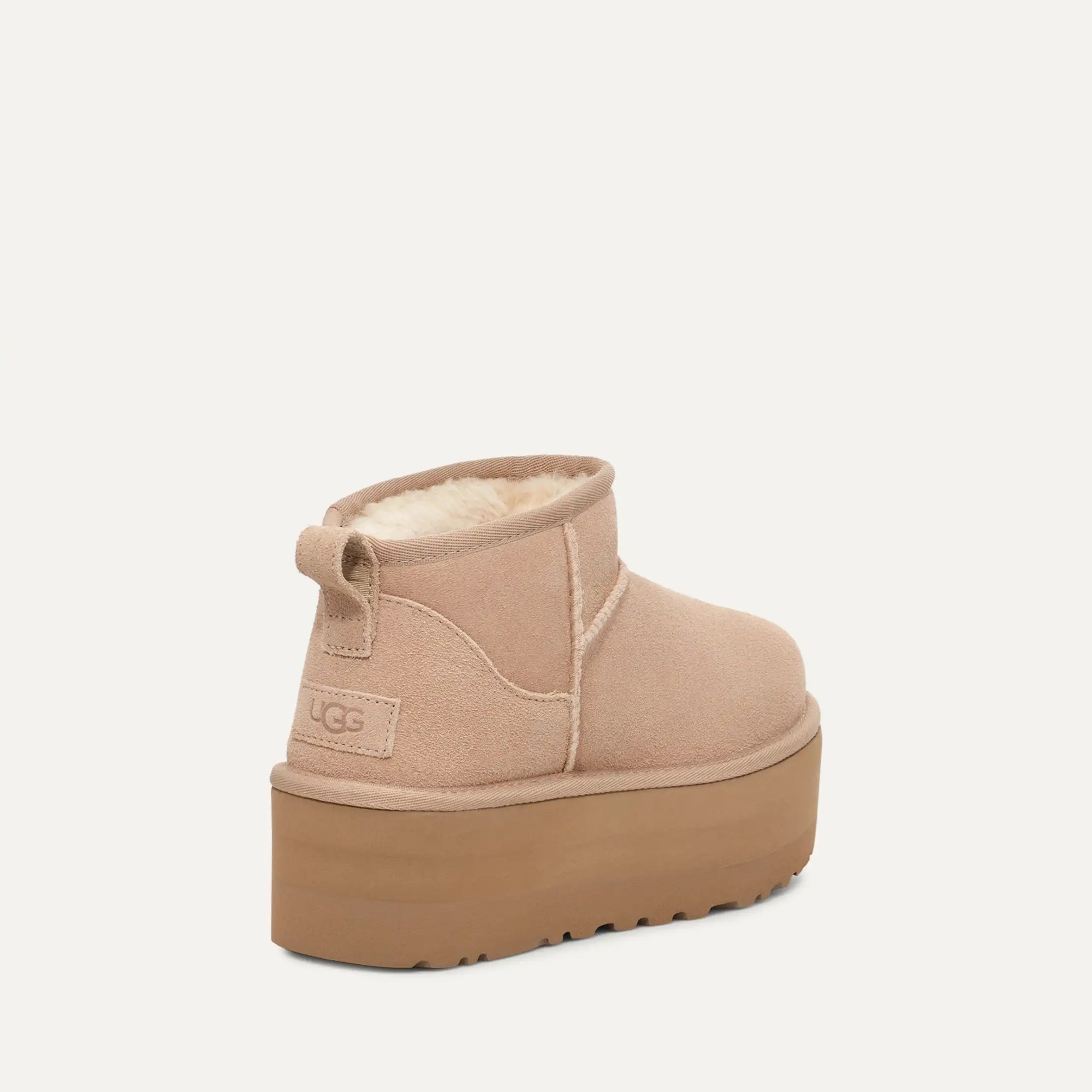 Beige UGG platform boot on a white background